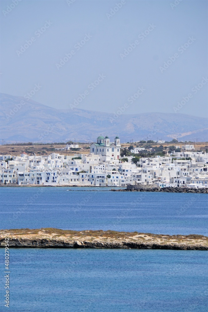 Town with a church located at the Mediterranean Sea in Paros, Greece