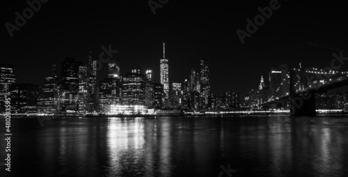 Partial night view of Manhattan from Brooklyn photographed in black and white