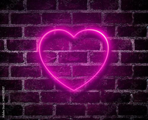 Bright hearts neon sign.Retro red brick wall background background.Happy Valentine's Day design