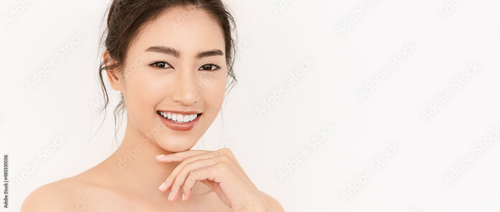Closeup portrait of beauty asian woman with fair perfect healthy glow skin hand touching chin isolated on white, young beautiful asia girl with pretty smile on face. Beauty korean spa skincare banner Closeup portrait of beauty asian woman with fair perfect healthy glow skin hand touching chin isolated on white, young beautiful asia girl with pretty smile on face. Beauty korean spa skincare banner
