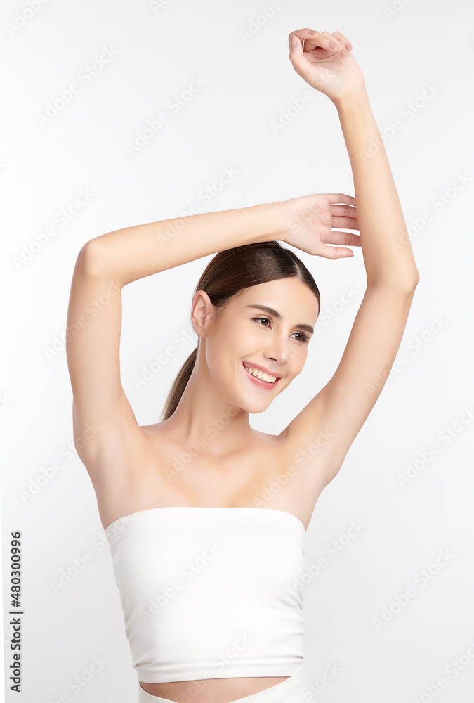 Beautiful Young Asian woman lifting hands up to show off clean and hygienic armpits or underarms on white background, Smooth armpit cleanliness and protection concept Beautiful Young Asian woman lifting hands up to show off clean and hygienic armpits or underarms on white background, Smooth armpit cleanliness and protection concept