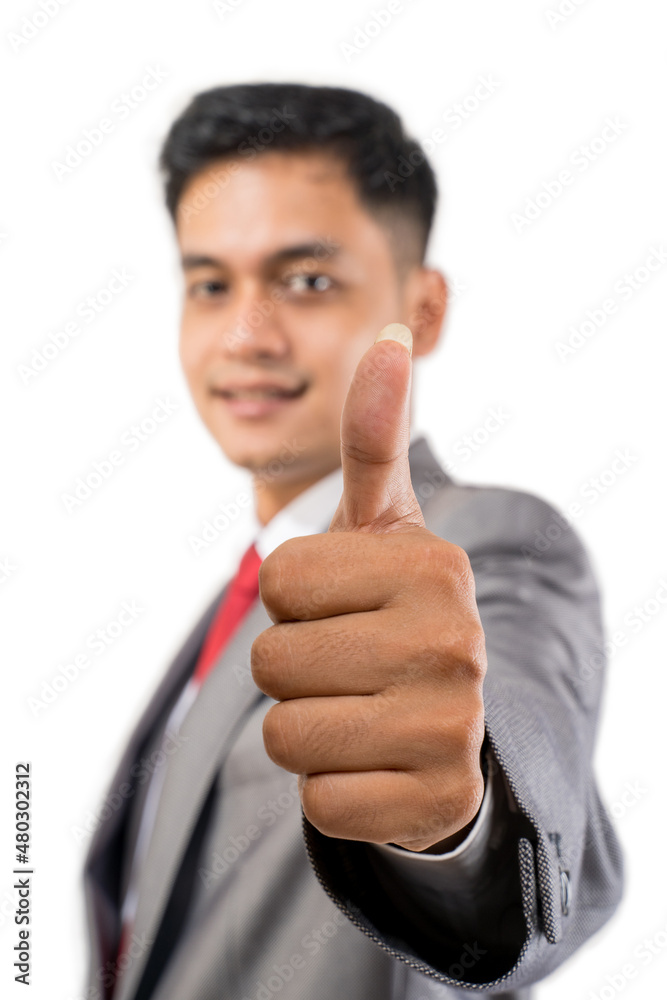 businessman showing thumb up close up to camera businessman showing thumb up close up to camera