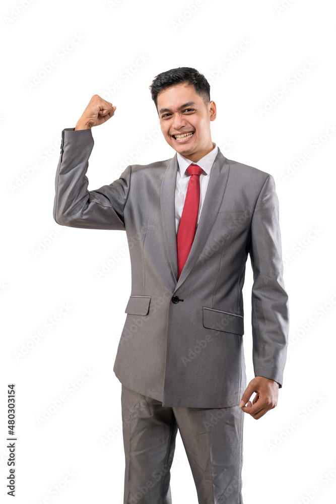 excited young businessman raise his hand isolated over white excited young businessman raise his hand isolated over white