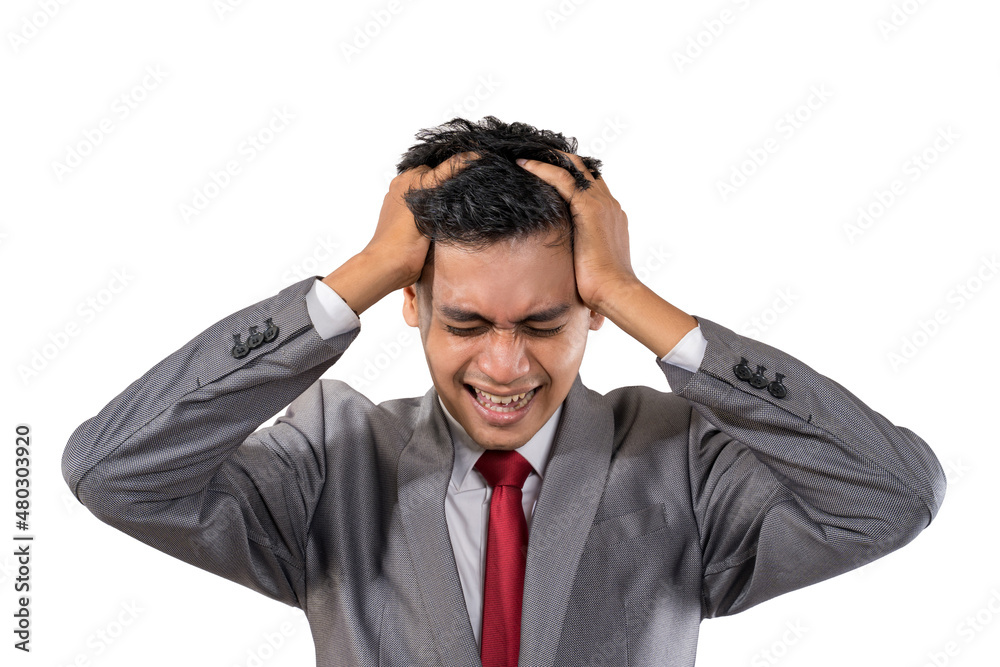 stressed young businessman holding his head isolated stressed young businessman holding his head isolated