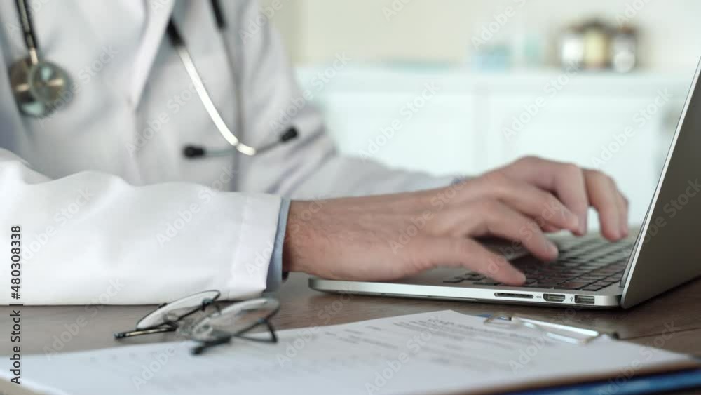 Senior doctors hands diagnosis and typing on laptops keyboard. Modern healthcare, online medical help. Telemedicine, distance counsulting concept. Close up view. 4k footage Senior doctors hands diagnosis and typing on laptops keyboard. Modern healthcare, online medical help. Telemedicine, distance counsulting concept. Close up view. 4k footage