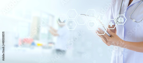 Doctor using a digital tablet with healthcare medical and technology icon 