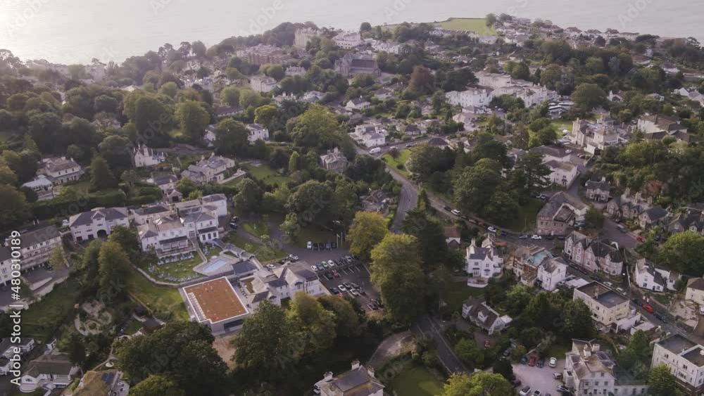 Flying backwards Aerial Drone of Torquay, Devon revealing houses