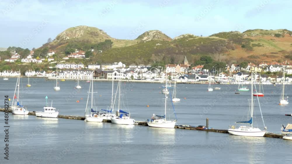 Various fishing boats and yachts moored along scenic hillside tourism town waterfront landscape Various fishing boats and yachts moored along scenic hillside tourism town waterfront landscape
