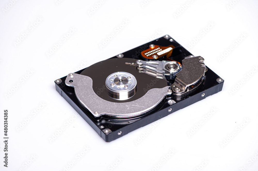 Close up inside of computer hard disk drive HDD isolated on white background Close up inside of computer hard disk drive HDD isolated on white background