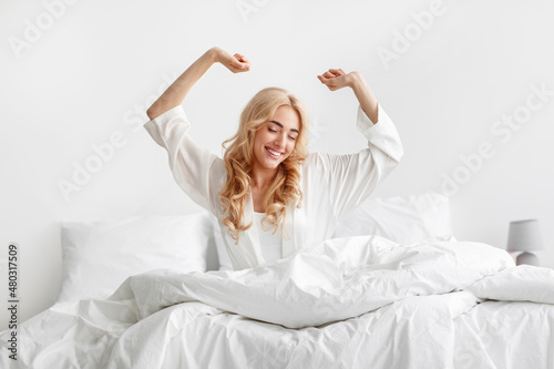 Fotografie Happy awakening after great nights rest at home, full of vigor and energy at wee