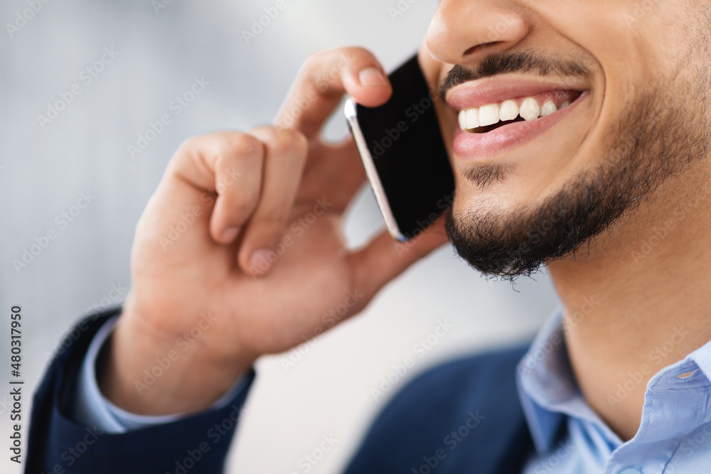 Phone Call. Closeup Shot Of Smiling Arab Man Talking On Cellphone Phone Call. Closeup Shot Of Smiling Arab Man Talking On Cellphone