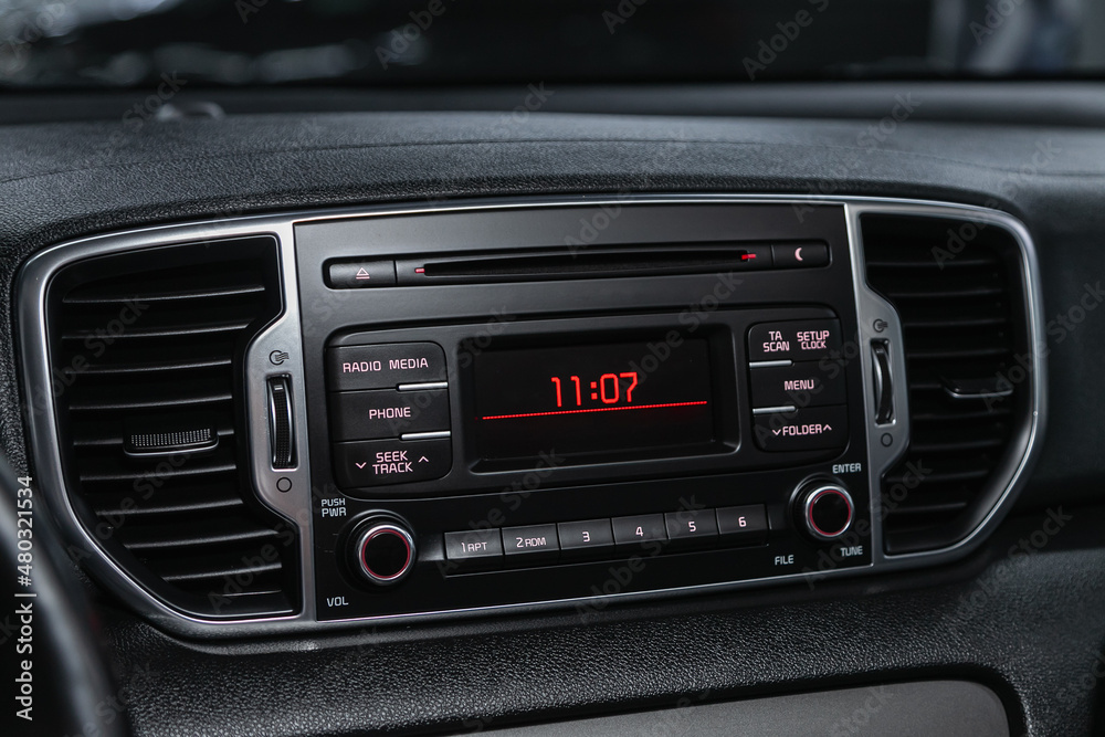 Car control panel of audio player and other devices.A shallow depth of field close up of the control panel of a car..