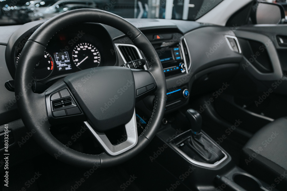 Interior of new modern SUV car with automatic transmission, dashboard.