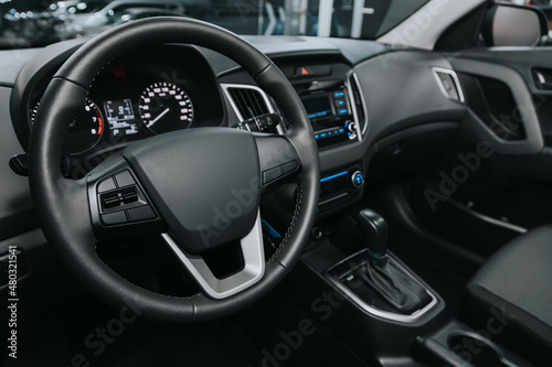 Interior of new modern SUV car with automatic transmission, dashboard.