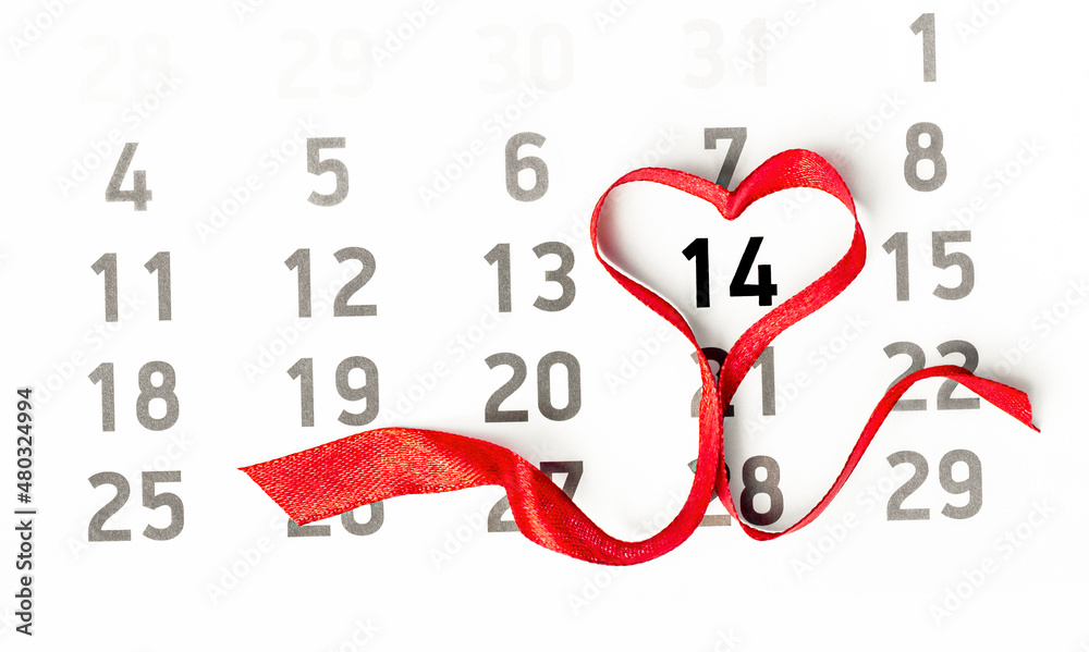 calendar with red heart shaped ribbon