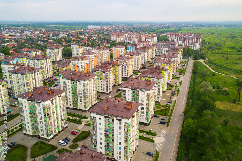 Aerial view of city residential area with high apartment buildings.