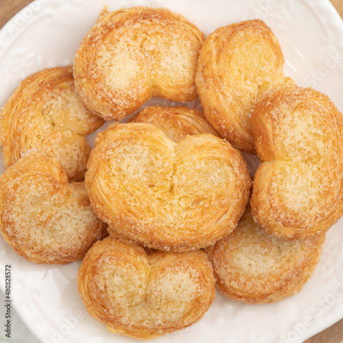 Delicious Palmier butterfly pastry in heart shape for Valentine's day dessert.