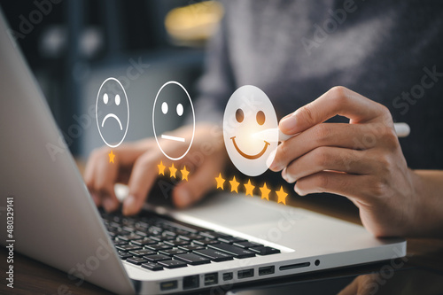 Konstfotografi User give rating to service experience on online application for Customer review satisfaction feedback survey concept