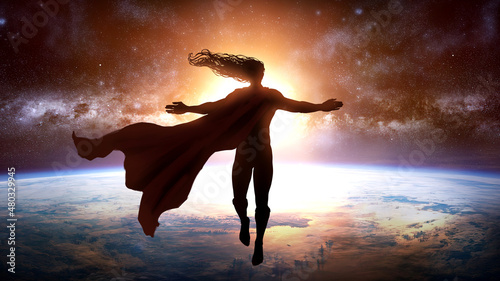 Fotografering A handsome superhero man with long hair and a red cape flew out of the planet's