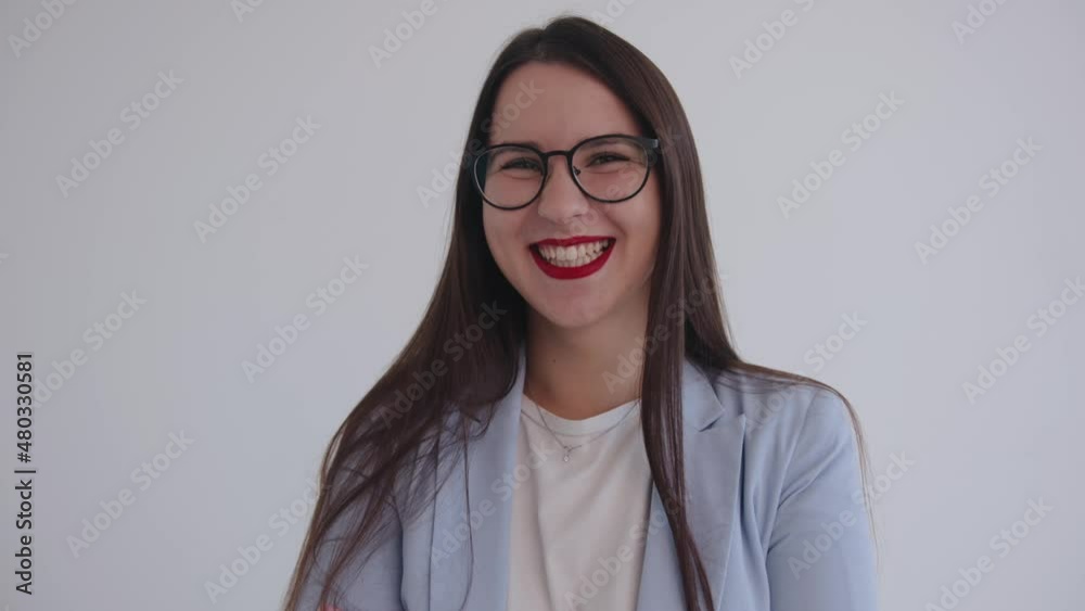 A beautiful young business lady is fooling around and showing her tongue laughing. Feminism. Woman power A beautiful young business lady is fooling around and showing her tongue laughing. Feminism. Woman power