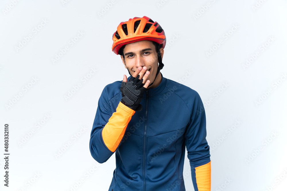 Young cyclist man isolated on background happy and smiling covering mouth with hand Young cyclist man isolated on background happy and smiling covering mouth with hand