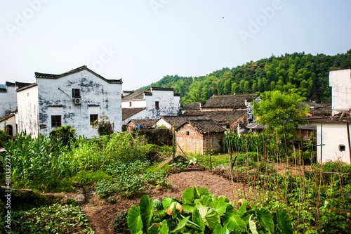 Li Keng, Wuyuan County, Shangrao City, Jiangxi Province, China - June 16, 2012. Ancient villages with Chinese Hui style and many unrecognizable visitors.