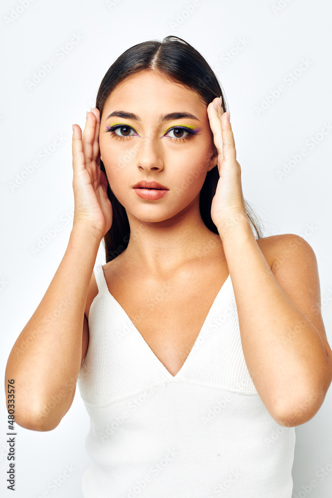 young woman attractive look fashion posing light background unaltered young woman attractive look fashion posing light background unaltered