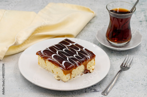 Caramel trilece dessert on stone background. Traditional Turkish cuisine flavor. close up photo