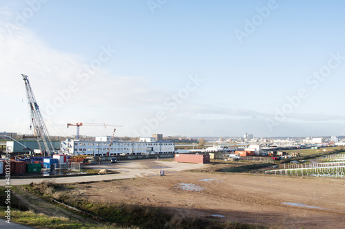 Industrial area around a shipyard with large cranes in Arnhem in the Netherlands © photosis