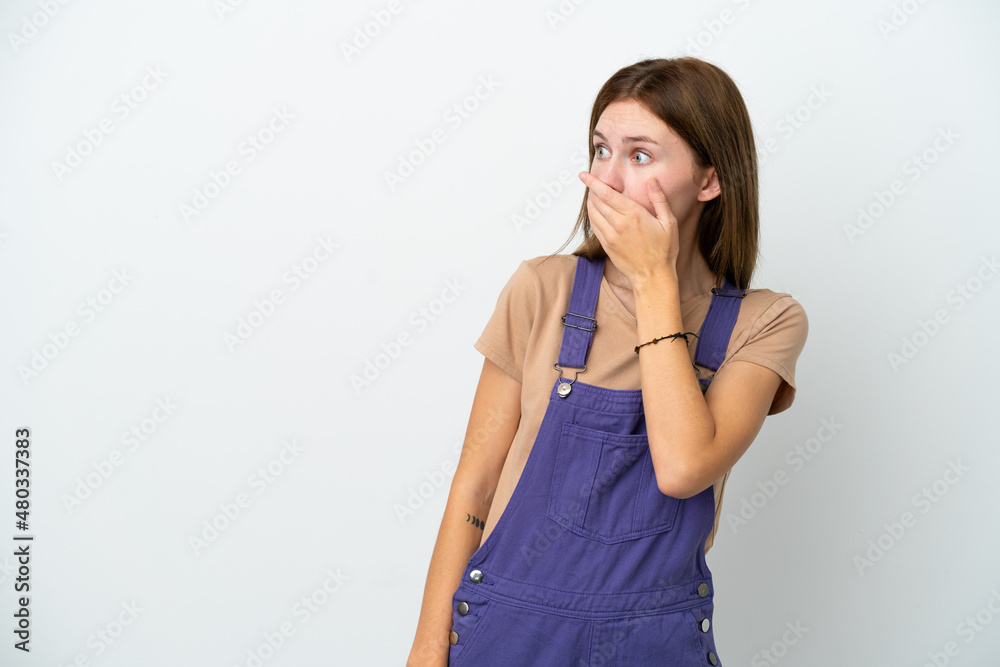 Young English woman isolated on white background doing surprise gesture while looking to the side Young English woman isolated on white background doing surprise gesture while looking to the side