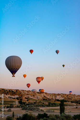 Cappadocia background photo. Hot air balloons in Cappadocia at sunrise.