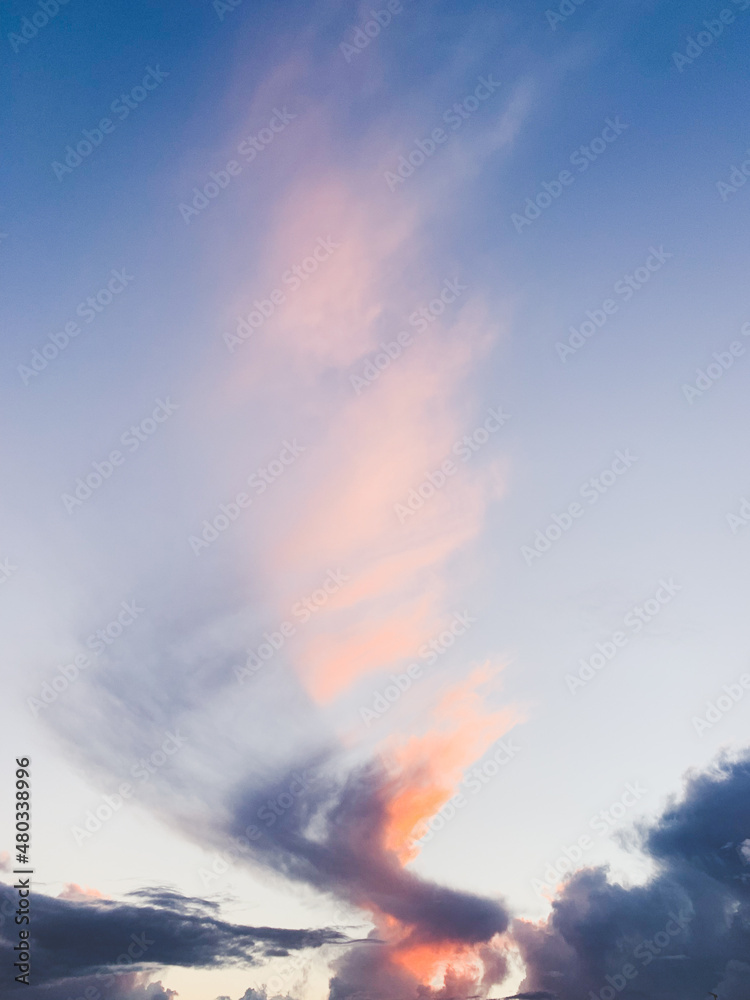 Fantastic colorful clouds in the blue sky, surrealistic nature background 
