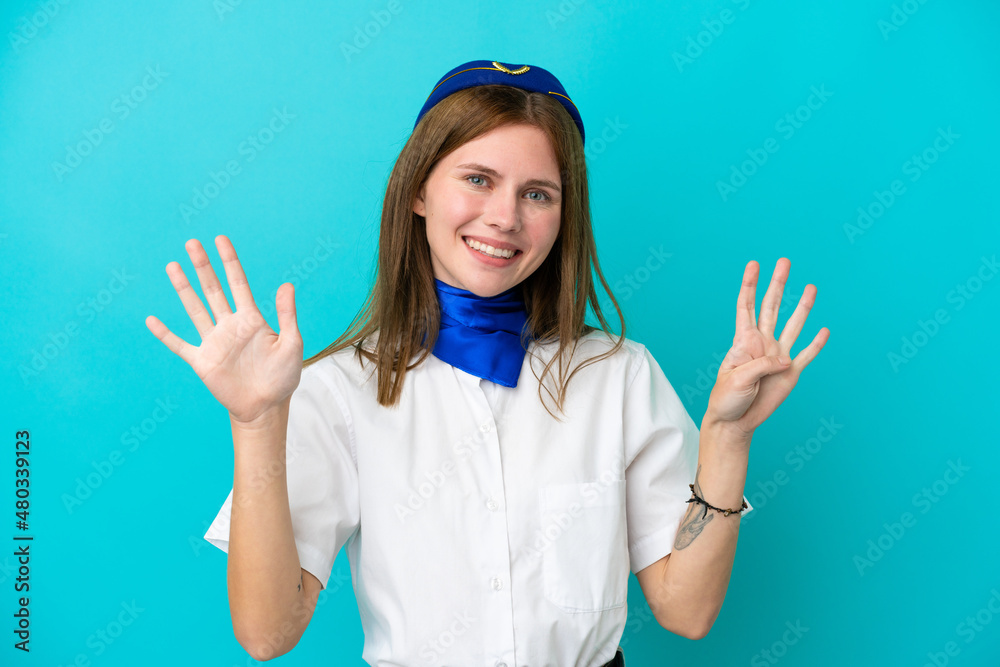Airplane stewardess English woman isolated on blue background counting nine with fingers Airplane stewardess English woman isolated on blue background counting nine with fingers