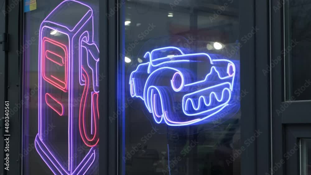 Astronaut bright LED sign. Car in the gas station neon blue sign