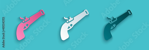 Paper cut Vintage pistol icon isolated on blue background. Ancient weapon. Paper art style. Vector