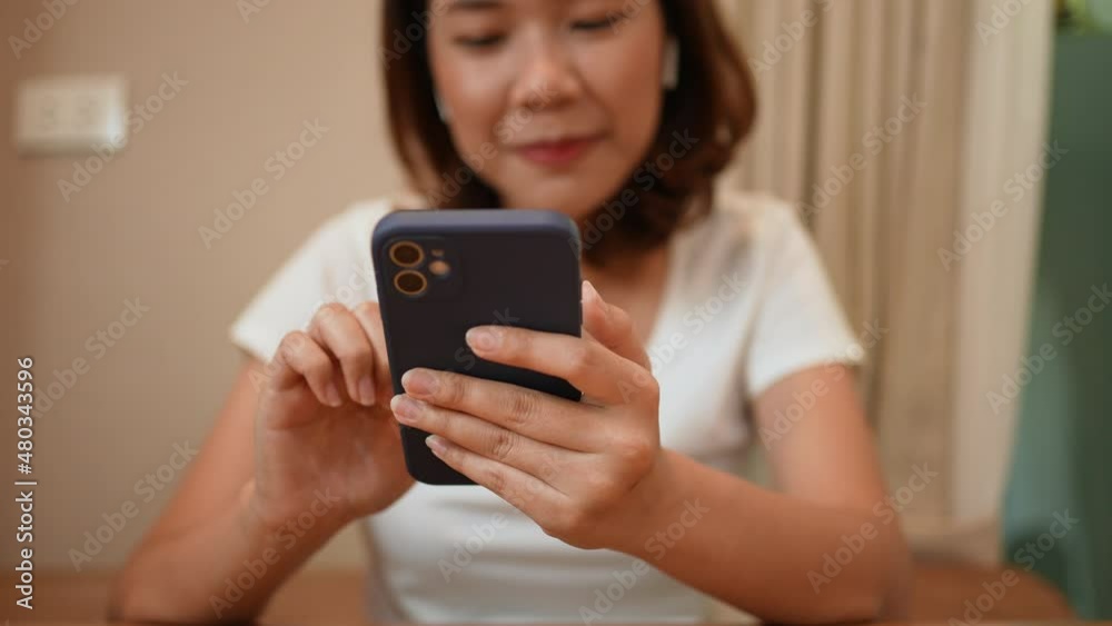 slow motion scene on asian woman wear headphone for listening pop music playlist at home in vacation for lifestyle and healthy mental concept slow motion scene on asian woman wear headphone for listening pop music playlist at home in vacation for lifestyle and healthy mental concept