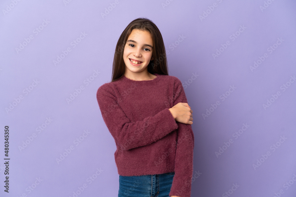 Little girl isolated on purple background laughing Little girl isolated on purple background laughing