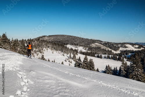 Skier walking in snowy winter country. Ski mountaineering in Great fatra mountains, SLovakia