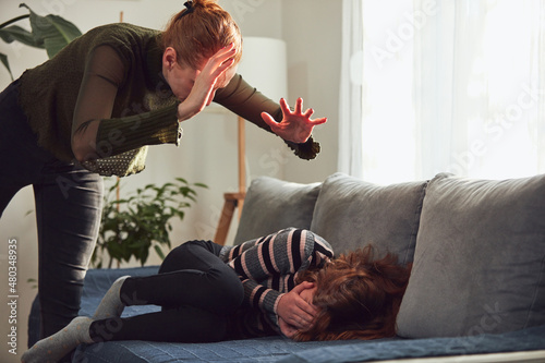 Photos Teenage girl in difficult mood with angry mom.