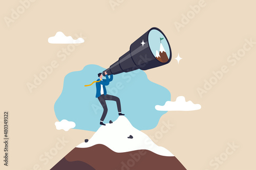 Ambition to aim high and achieve business goal, motivation to success, challenge and determination for victory concept, ambitious businessman look through telescope for mountain peak target. photo