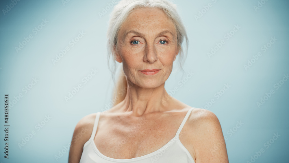 Portrait of Beautiful Senior Woman Looking at Camera and Smiling