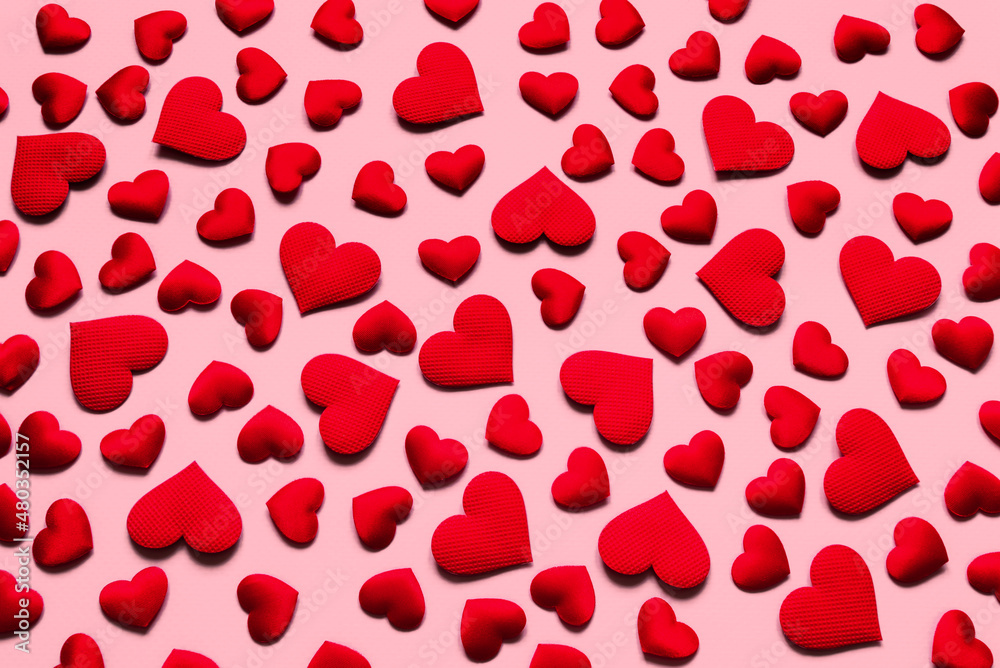 Flat lay of red valentine hearts on a pink background. Valentine's Day background Flat lay of red valentine hearts on a pink background. Valentine's Day background