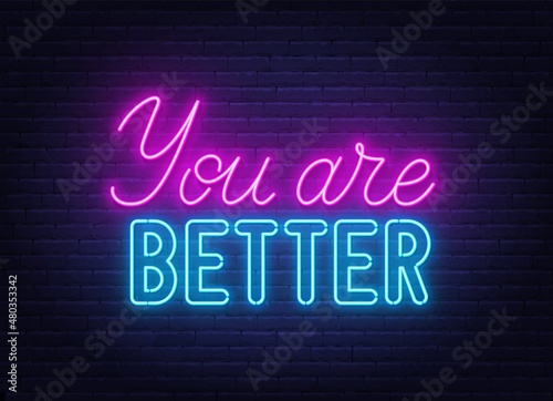 You Are Better neon quote on a brick wall.