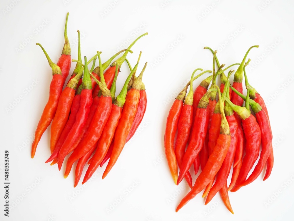 Red peppers on a white background. top view photo, blurred. Red peppers on a white background. top view photo, blurred.