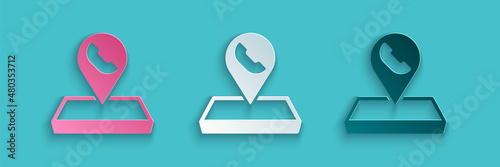 Paper cut Map pointer with telephone or communication icon isolated on blue background. Call center location. Paper art style. Vector