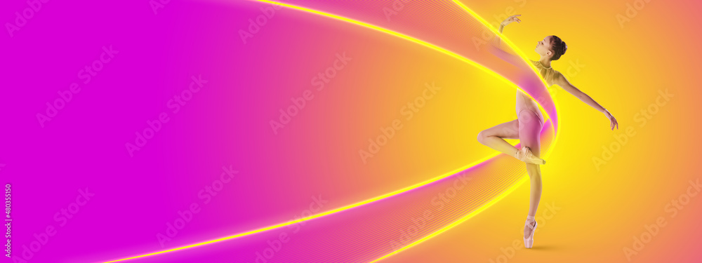 Beautiful young ballet dancer, flexible girl dancing isolated on pink-yellow background in neon light with luminescent lines, shapes.