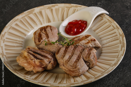 Grilled pork tenderlion with tomato sauce photo