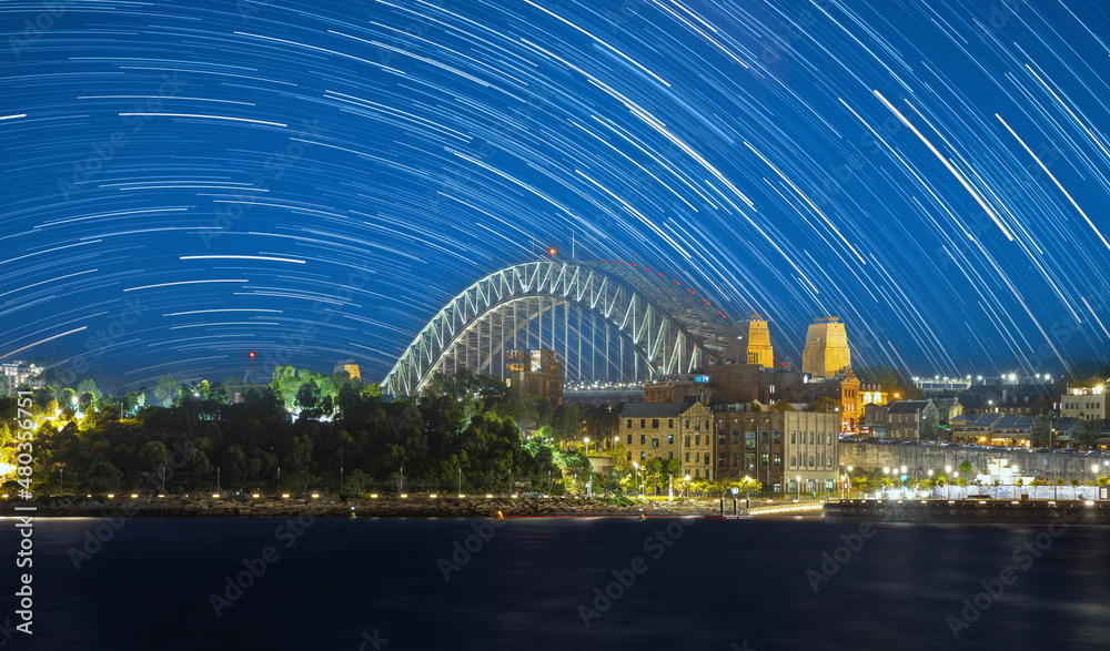 Fototapeta premium Startrails Star trails Sydney Harbour Bridge star trails in the night sky NSW Australia 