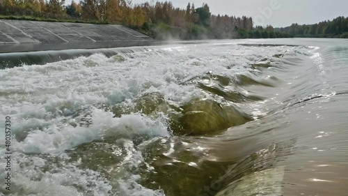 Cooling water output near nuclear power ctation in Smolensk. Slow motion view photo