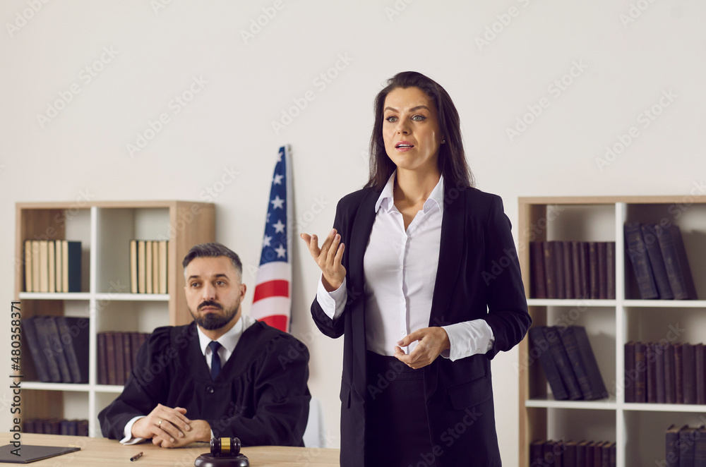 Female lawyer or defense attorney making passionate convincing speech defending her client